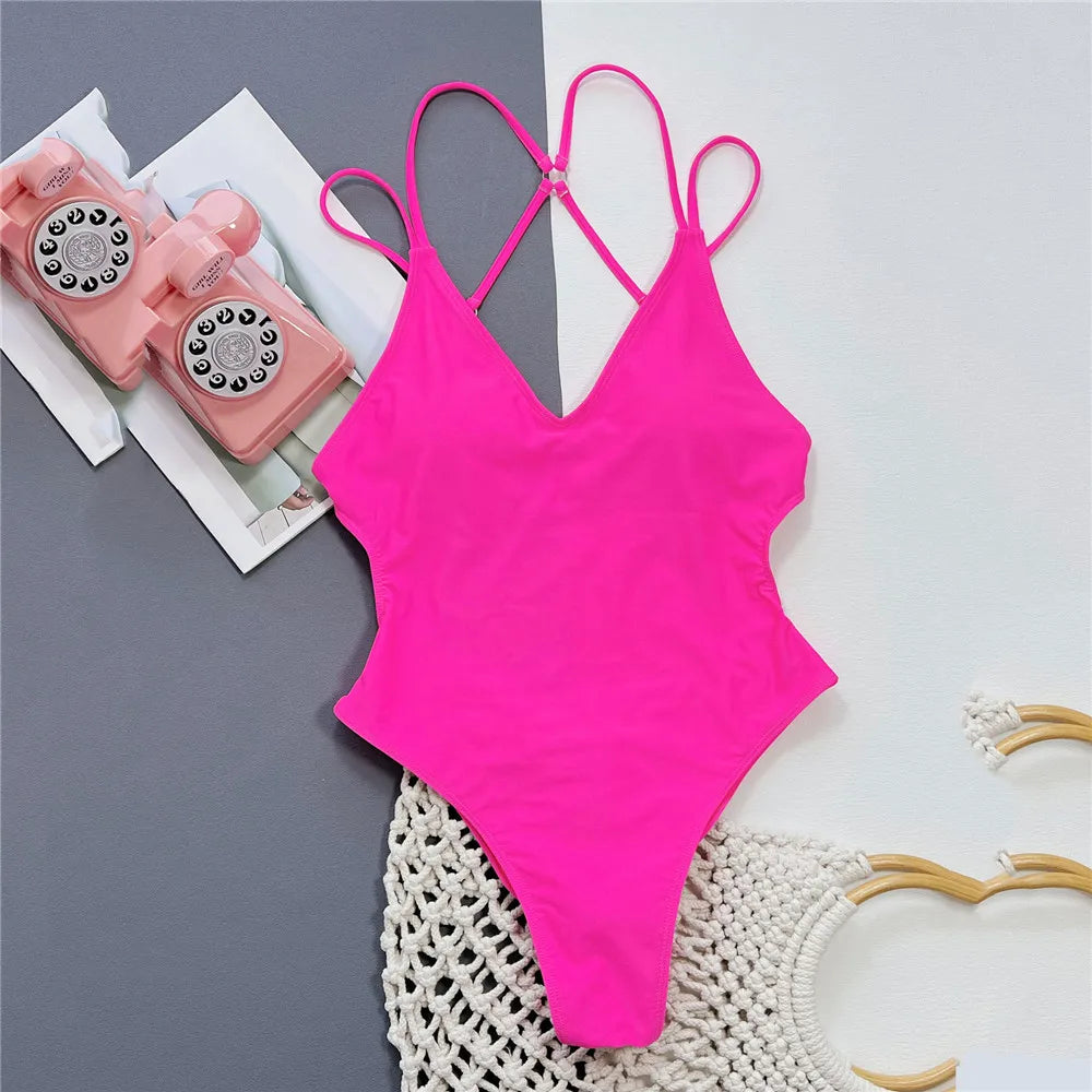 Backless one piece swimsuit in blue, rose red, and black, cross string, high cut, sexy women’s swimwear, FTF Fashion UK.