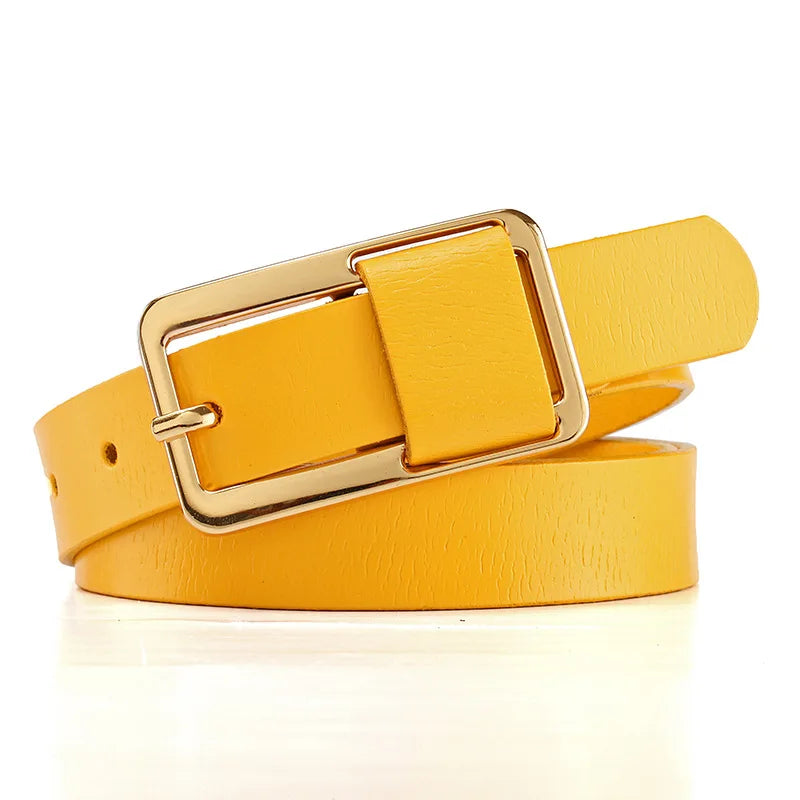 Yellow belt with a gold buckle on a white background. Women’s wide leather belt with cinched design and metal buckle. Enhances waistline for shirts, dresses, suits. Trendy, durable, UK fashion accessory.