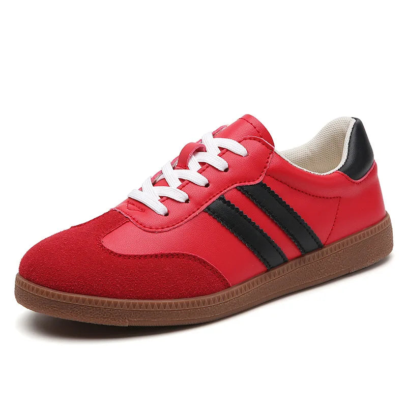 Top-down view showing the classic color blocking (red/black) and the cushioned tongue of the comfortable walking sneakers.