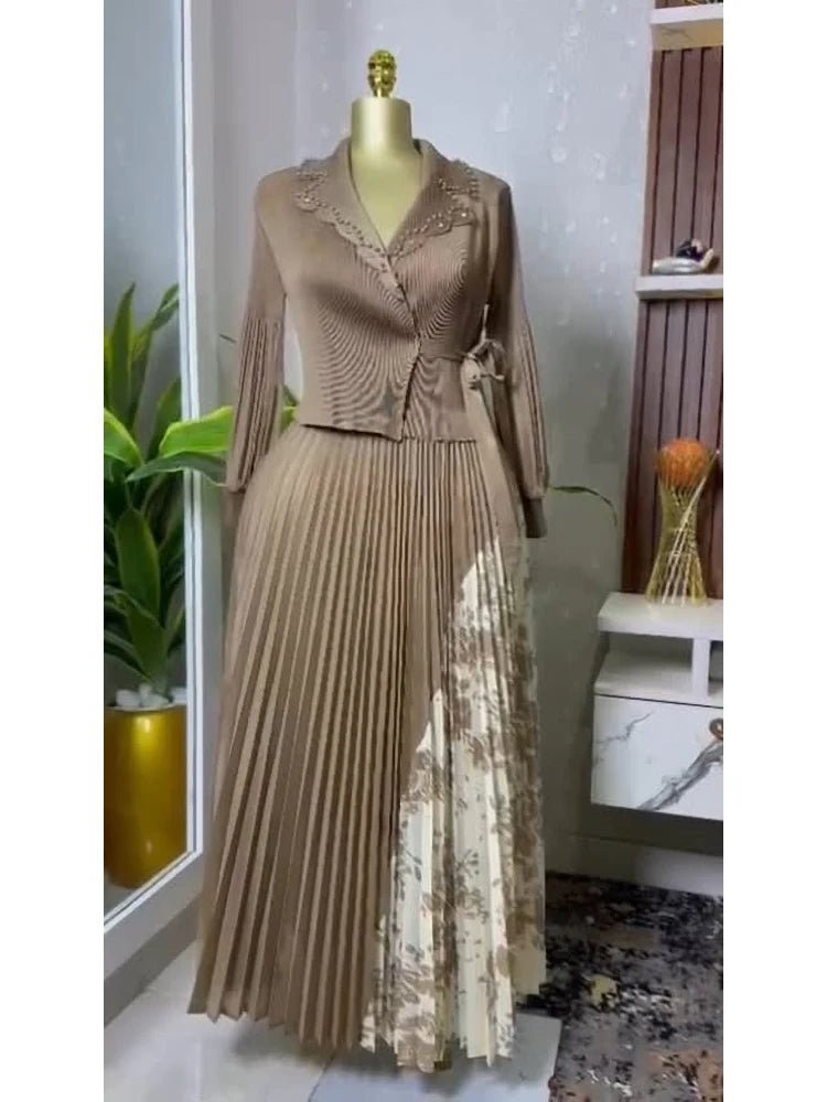 Brown dress with floral pattern on a mannequin against a neutral background. Elegant pleated A-line suit collar dress UK mid-calf length, slimming fit.