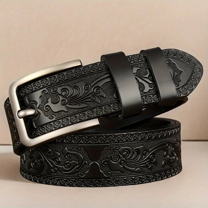 Black embossed belt with silver buckle on a beige background. Genuine split leather belt with retro western style and alloy buckle. Durable, stylish unisex belt for casual wear. Fast UK shipping.