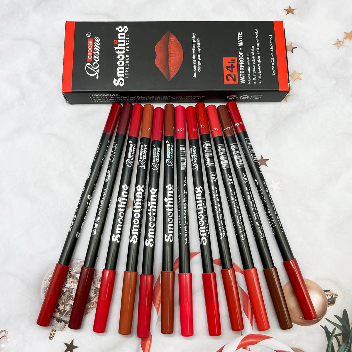 Set of lip pencils with a box labeled 'Smoother' on a decorative background. 12 pcs UK matte lipstick and liner set—velvet, long-lasting, vibrant, professional cosmetic gift for women, Valentine’s, travel beauty kit.