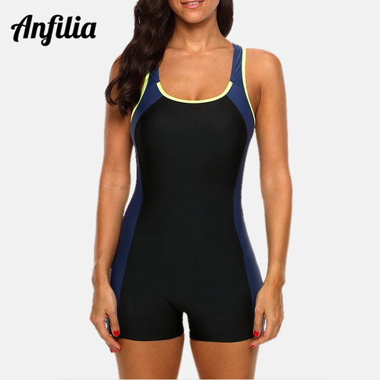 Woman wearing black navy colorblock athletic swimsuit with shorts — open back racerback FTF Market