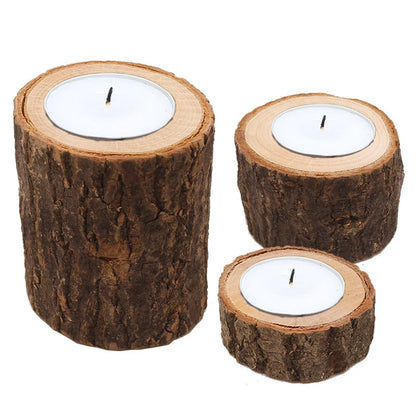 Three wooden candle holders with candles on a white background