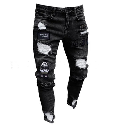Black distressed jeans with patches on a white background