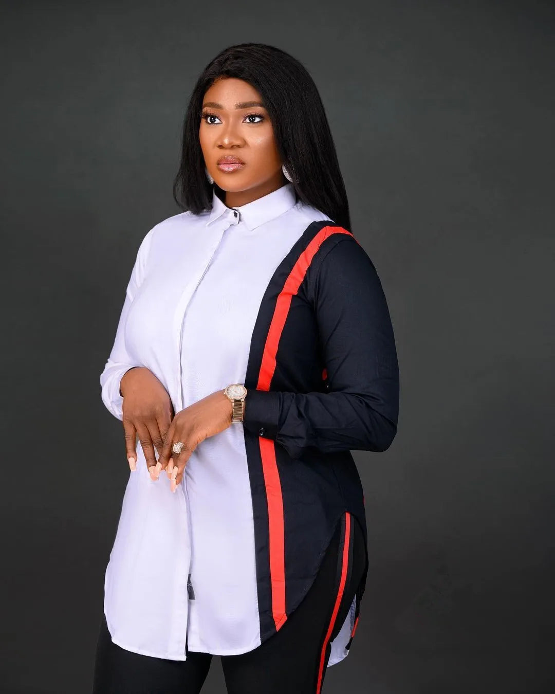 Woman wearing a black and red outfit with a white shirt on a dark background. Women’s stripe print long sleeve blouse and regular high waist pants set. Office lady outfit, comfortable, elegant, solid workwear for spring/autumn.