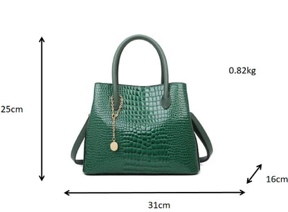 Green handbag with measurements on a white background. Large capacity portable women’s crossbody bag with soft handle, zipper closure, chain accents, solid color print, perfect for daily fashion.