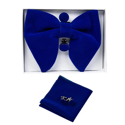 Blue bow tie and pocket square set with cufflinks in a box on a white background
