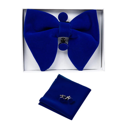 Blue bow tie and matching pocket square set in a box on a white background