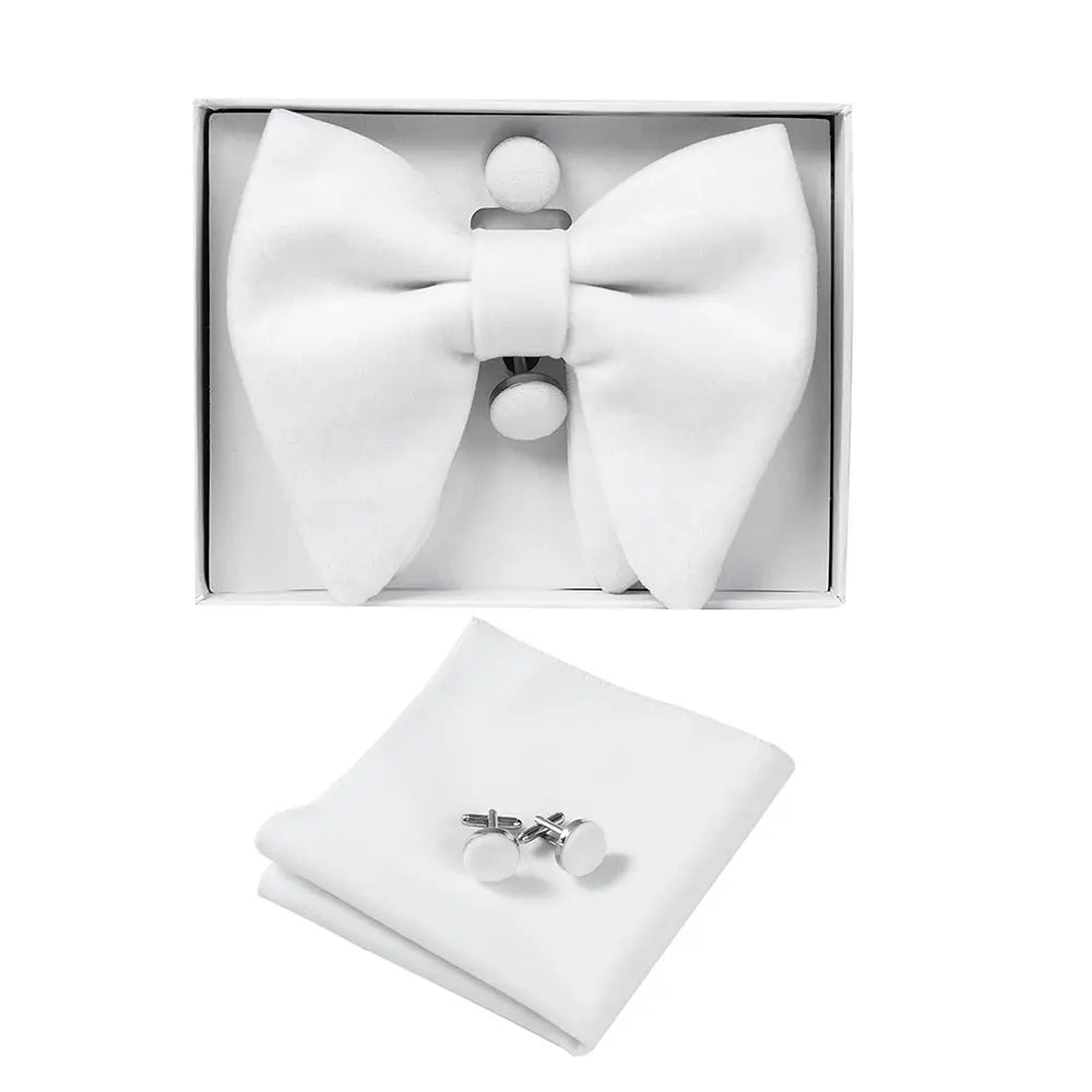 White bow tie and cufflinks set in a box on a white background