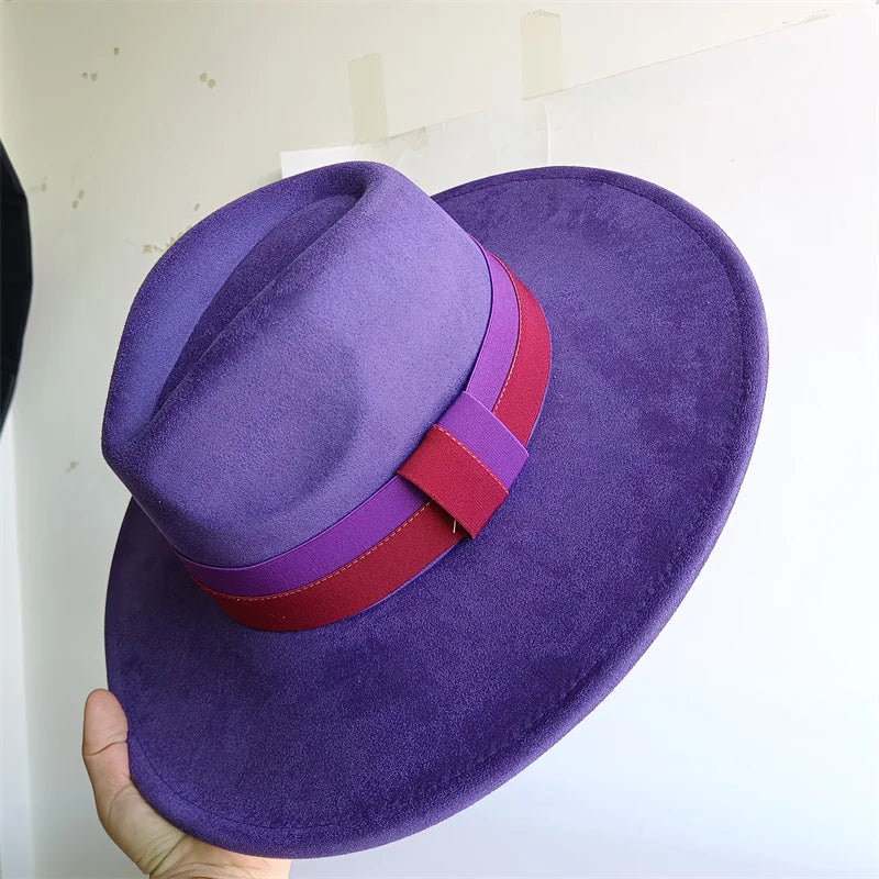 Purple hat with a red and purple band held against a white background