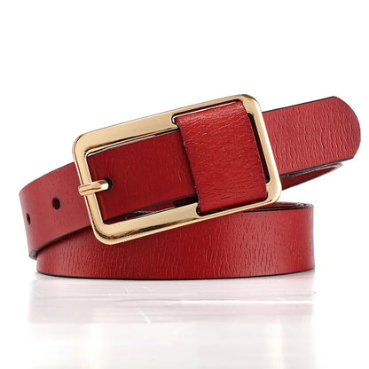 Red leather belt with a gold buckle on a white background. Women’s wide leather belt with cinched design and metal buckle. Enhances waistline for shirts, dresses, suits. Trendy, durable, UK fashion accessory.