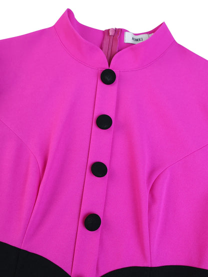 Close-up of a bright pink jacket with black buttons on a white background