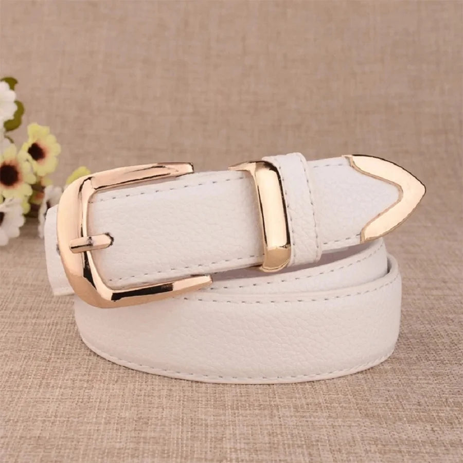 White belt with gold buckle on a beige background. Women’s vintage white leather trouser belt with solid pin buckle. Stylish, high-quality accessory for fashion-forward looks, UK.