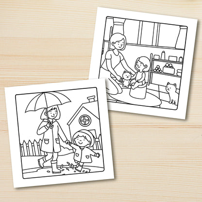 Two coloring pages on a wooden surface, one with a child and umbrella, the other with a family scene. Adult coloring book titled MOM MOMENTS featuring cozy daily scenes for relaxation, cute mindful activities, FTF Fashion UK.
