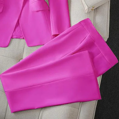 Pink pants on a light gray surface with a blurred background