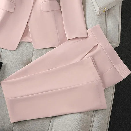 Pink pants on a light gray surface