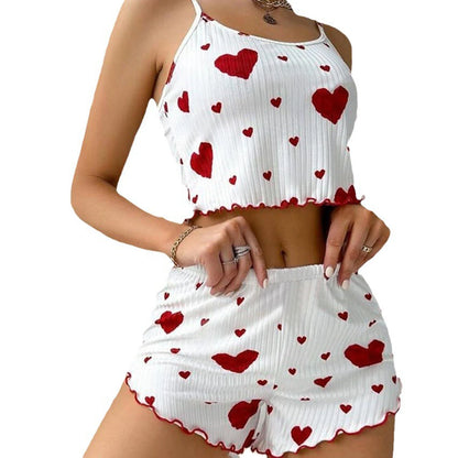 White sleeveless top and shorts set with red heart patterns on a white background. Soft women’s pajama set, 2 pieces white tank top and shorts, breathable fabric with love print, comfortable casual sleepwear, UK FTF Market.
