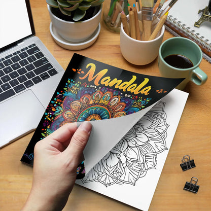 Coloring book with mandala design held over a coloring page on a desk with laptop, coffee, and stationery. Mandala coloring book for adults, stress relief, relaxation, creative color practice, perfect birthday party gift, UK FTF Market.