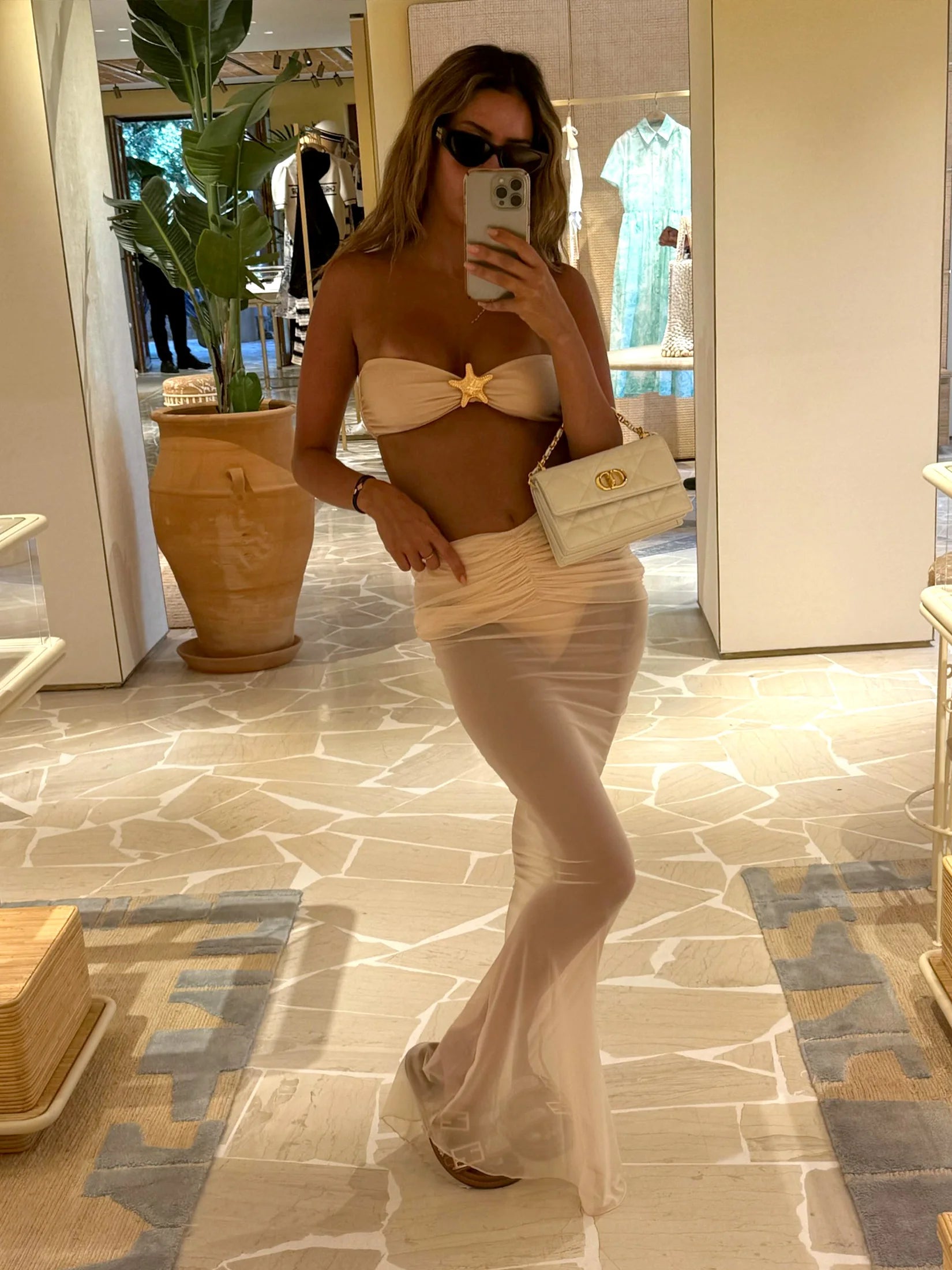 Woman sitting in beige 3-piece bandeau bikini set — high waist swimwear women S M L