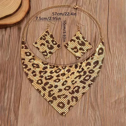 Leopard print necklace and earrings on a wooden surface with measurements. Women’s fashion jewelry set with leopard print triangle scarf necklace and sparkling drop earrings, perfect for parties and stylish events.