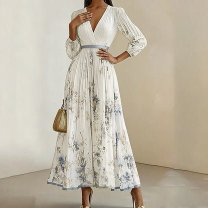Woman wearing a white floral dress with a plain background