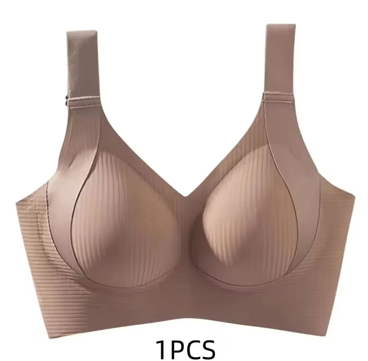A single-piece wireless bra in a light nude beige color, featuring ribbed cups and a wide underband, shown against a plain white background with '1PCS' text below.