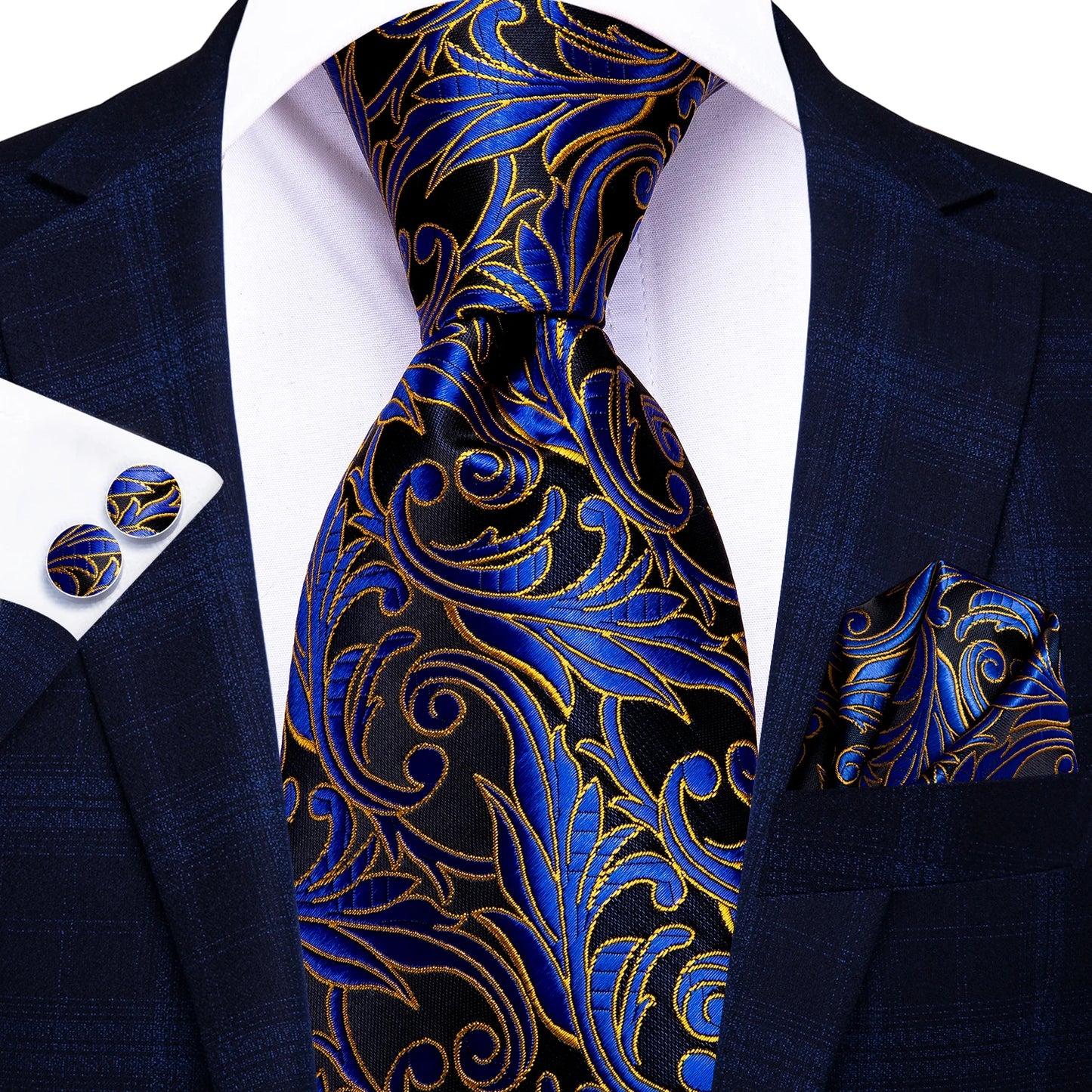 Navy suit with blue and gold paisley tie, pocket square, and cufflinks on a white background. Men’s luxury paisley silk tie and pocket square set, 8.5cm wide, for business or wedding. Red formal necktie, ftf fashion UK.
