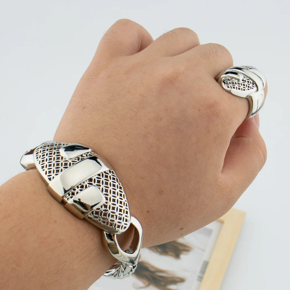 Woman wearing silver plated hollow-out cuff bangle and matching geometric ring on wrist lifestyle shot