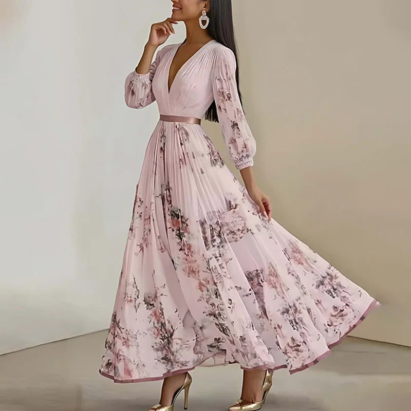 Woman wearing a pink floral dress against a neutral background