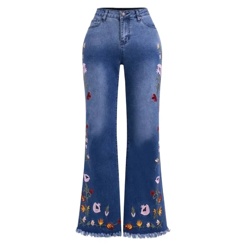 Blue jeans with floral embroidery on a white background