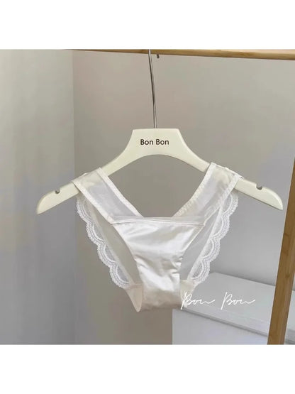 White lace bra on a hanger with 'Bon Bon' branding against a neutral background