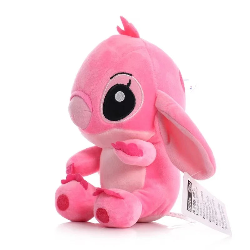 Pink plush toy with a tag on a white background