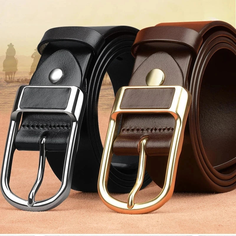 Two leather belts with metal buckles on a textured surface
