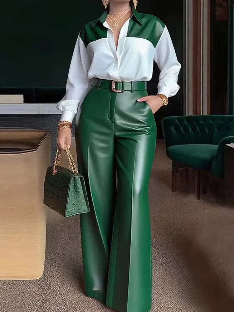 Person wearing a white and green shirt with green pants in an indoor setting
