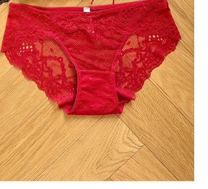 Red lace underwear on a wooden floor