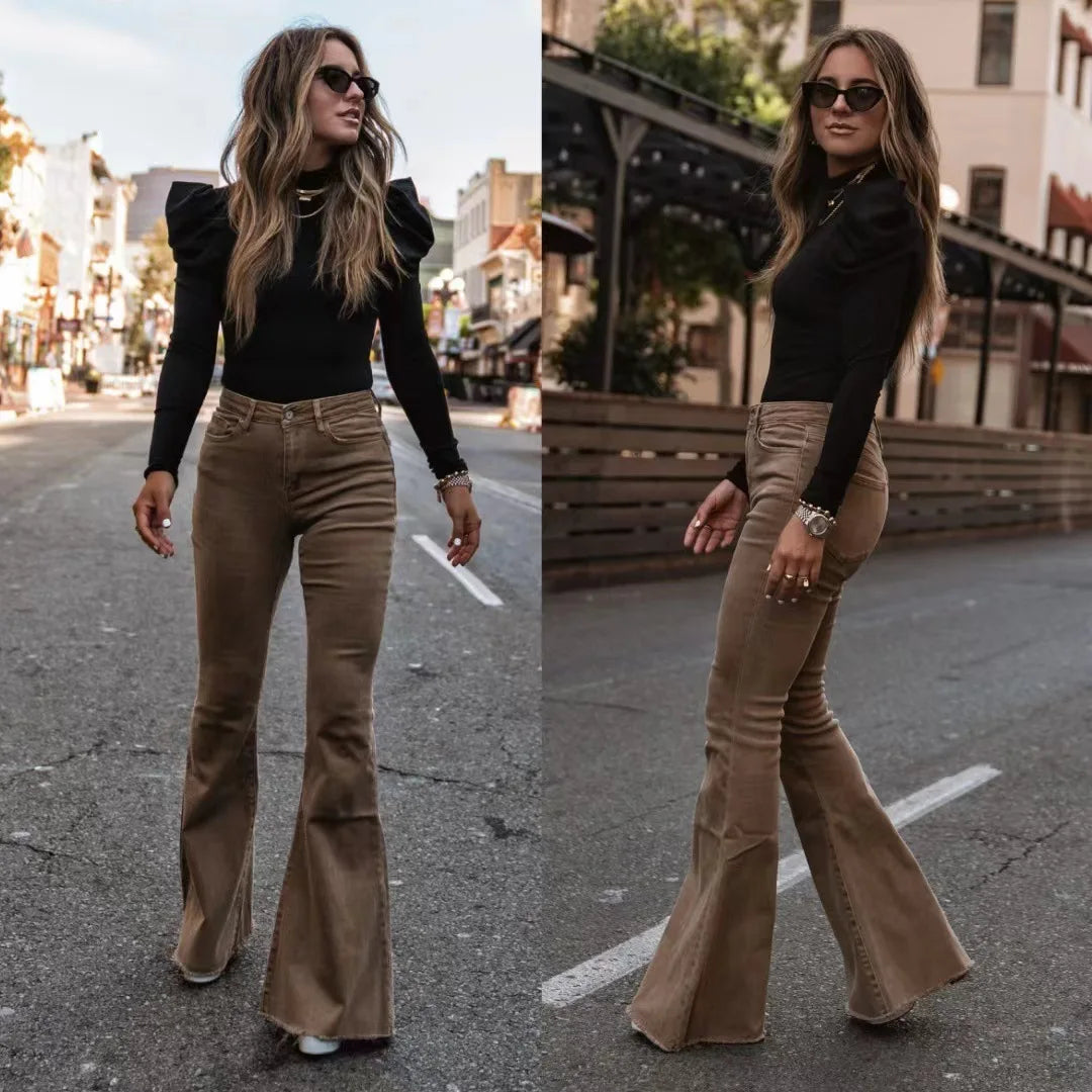 Woman wearing a black top and brown flared pants on a city street. Slim micro flare corduroy trousers with elastic waistband, screw thread button detail, casual style for women. Available in multiple colors UK FTF Market.