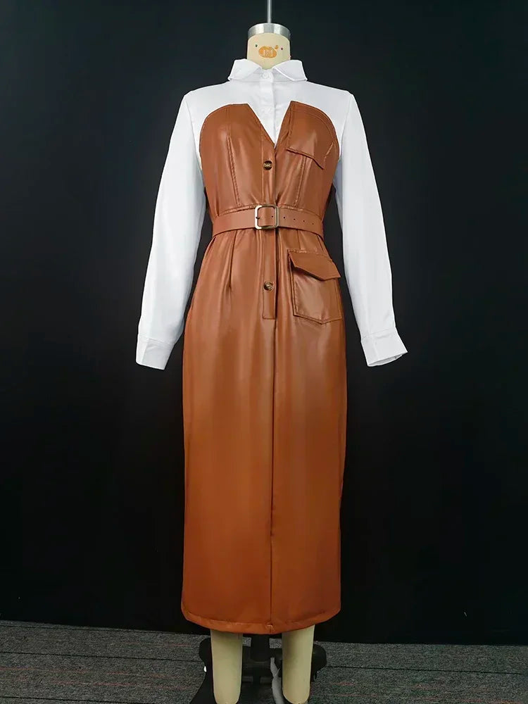 Brown leather dress over a white shirt on a mannequin against a black background