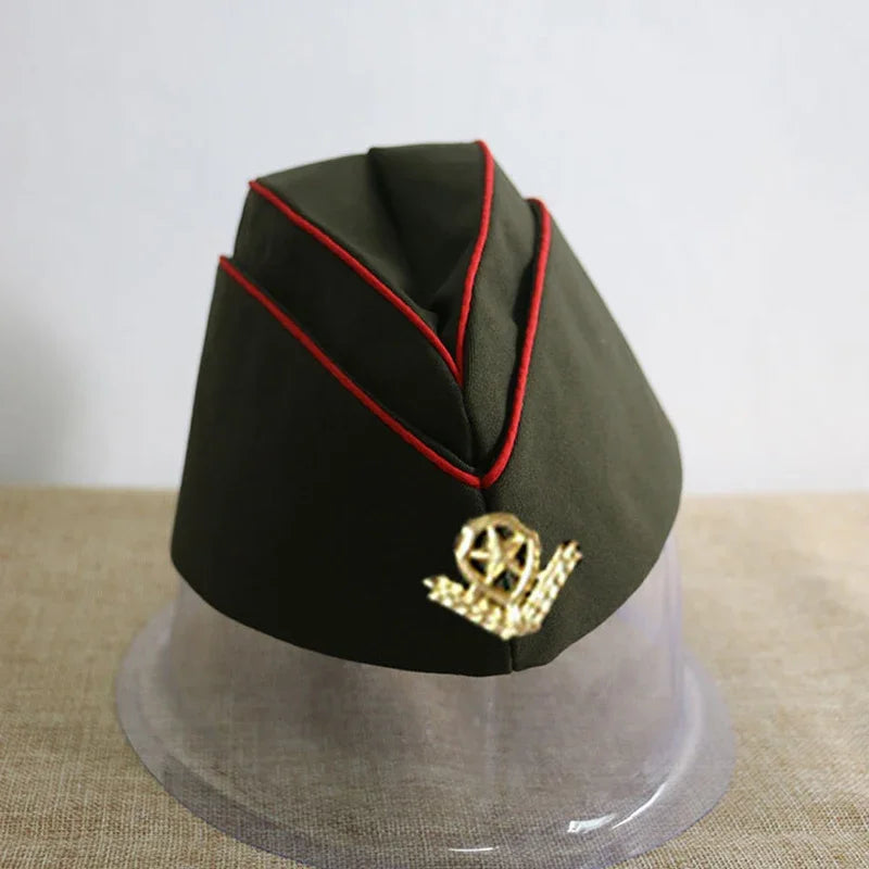 Green military-style cap with red trim and gold emblem on a neutral background
