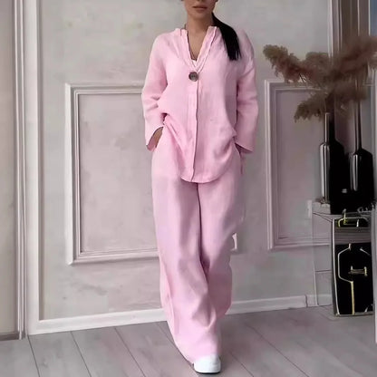 Women's 2-piece linen set in pink — relaxed fit V-neck top and wide leg trousers...