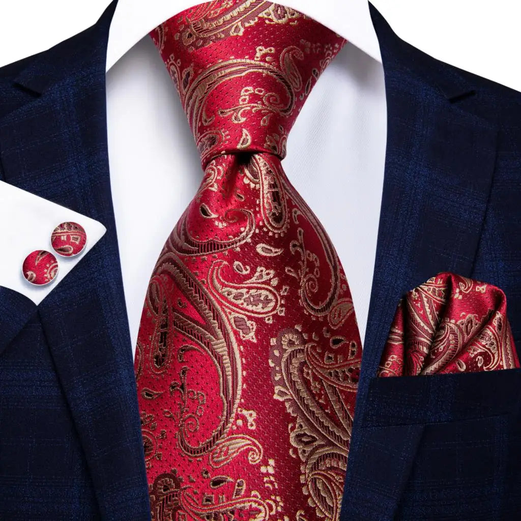 Red paisley tie with matching cufflinks and pocket square on a navy suit jacket. Men’s luxury paisley silk tie and pocket square set, 8.5cm wide, for business or wedding. Red formal necktie, ftf fashion UK.