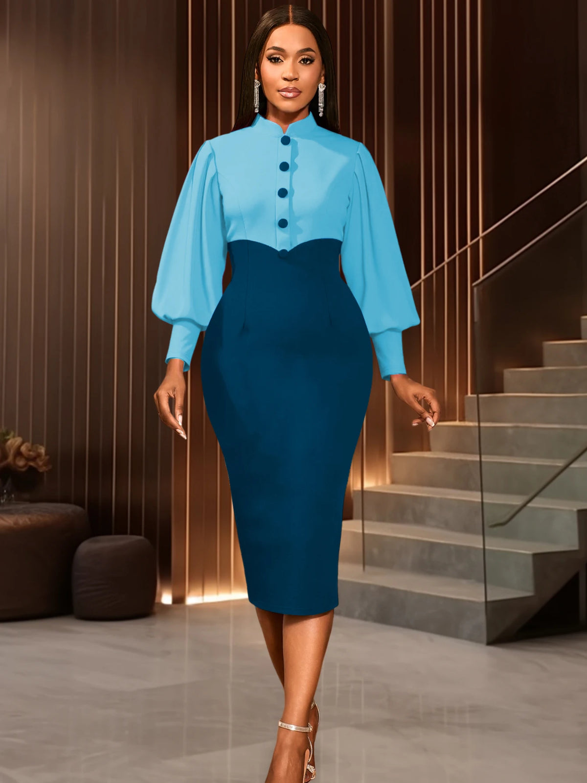 Woman in a blue top and teal pencil skirt walking down stairs.
