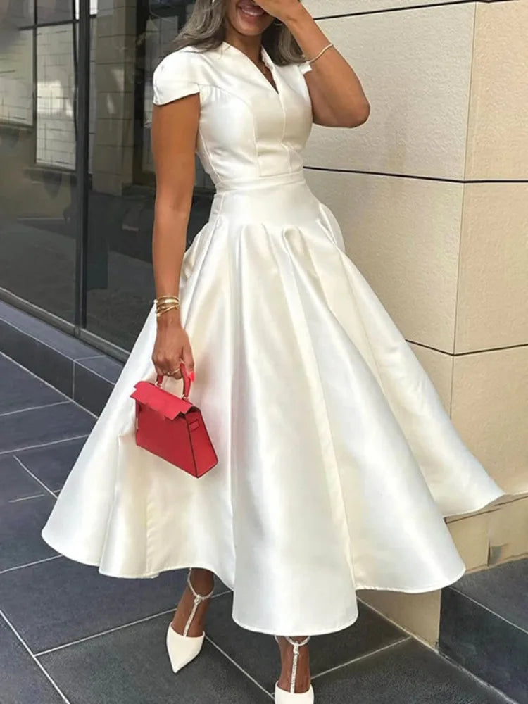 Luxury white satin pleated maxi dress with V-neck and short sleeves – A-line silhouette for formal occasions