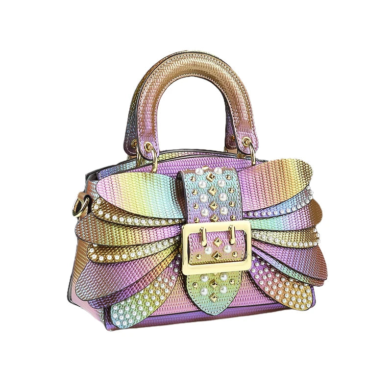 Multicolored handbag with decorative elements on a white background. Women’s pearl riveted leather bag—animal print, trapezoid box shape, shoulder/crossbody style, soft handle, stylish UK fashion messenger handbag.