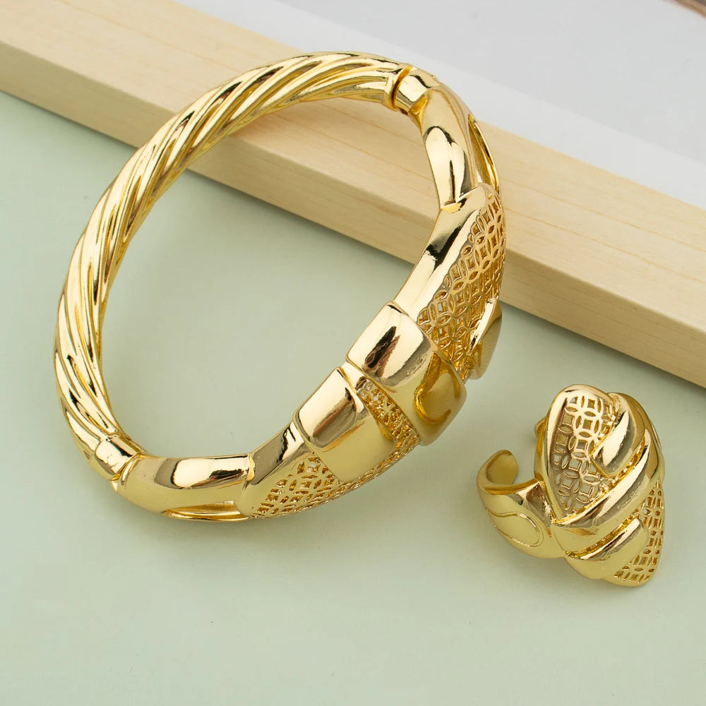 18K gold plated cuff bangle and matching ring set with hollow-out geometric design on mint green background