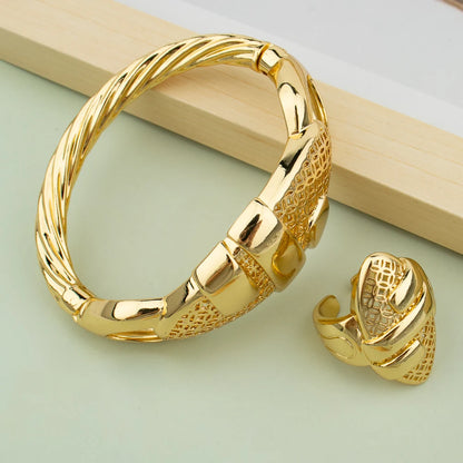 18K gold plated cuff bangle and matching ring set with hollow-out geometric design on mint green background