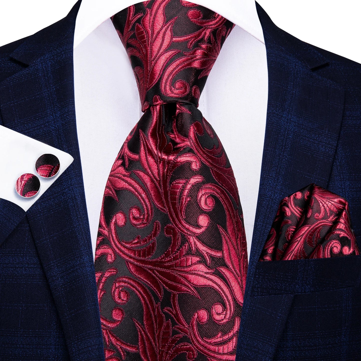 Red and black patterned tie with matching pocket square and cufflinks on a navy suit. Men’s luxury paisley silk tie and pocket square set, 8.5cm wide, for business or wedding. Red formal necktie, ftf fashion UK.