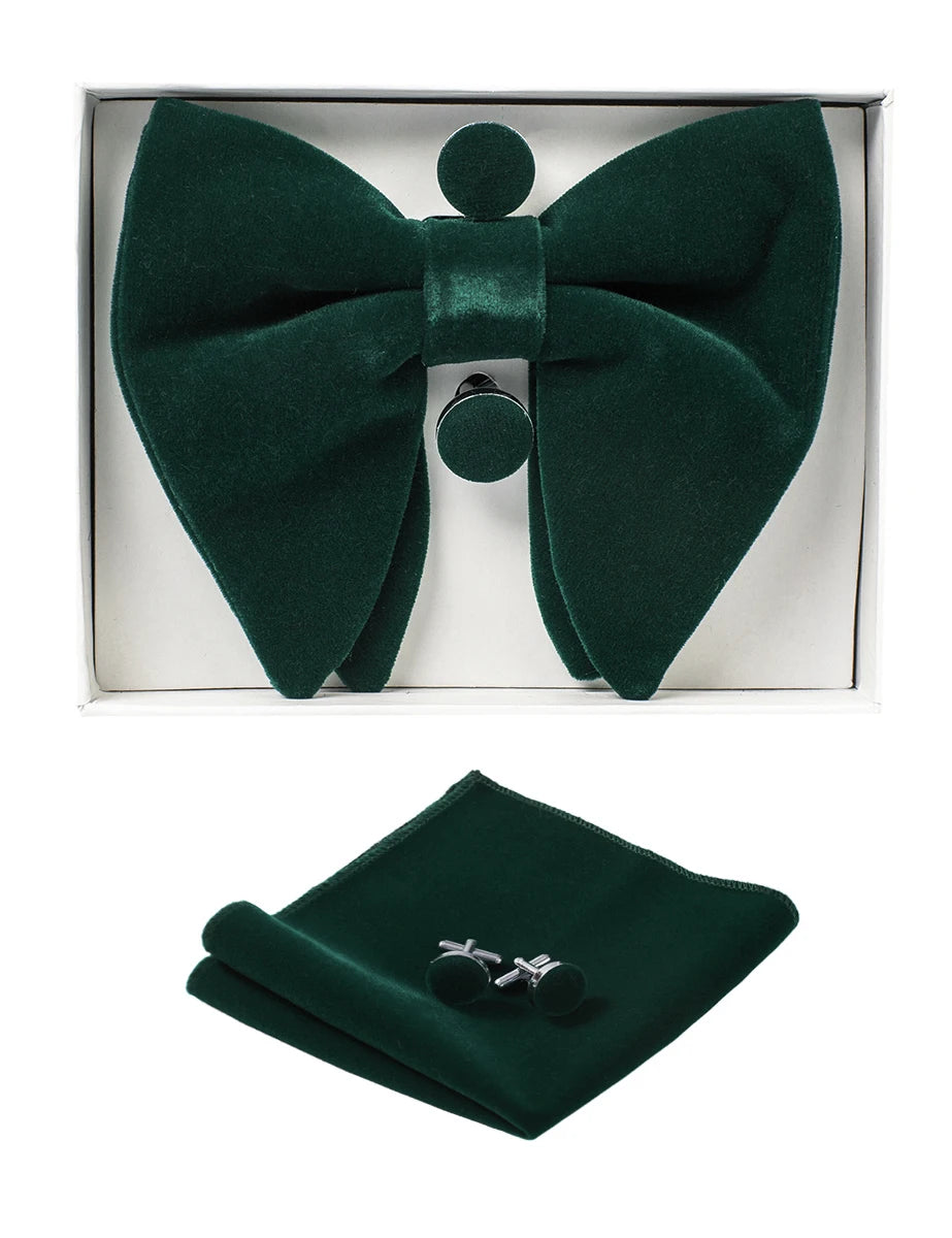 Green bow tie, pocket square, and cufflinks set in a box on a white background