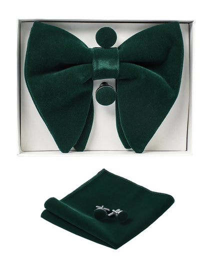 Green bow tie, pocket square, and cufflinks set in a box on a white background