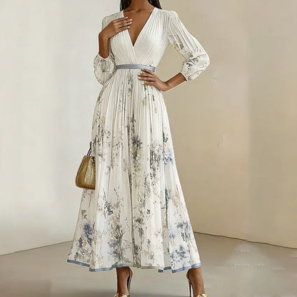 Woman wearing a white floral dress with a plain background